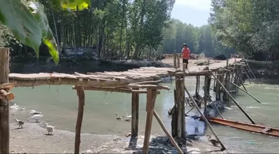 makeshift wooden bridge poses threat to residents of kupwara areas