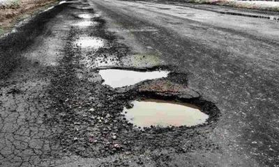 pothole ridden road irks kulgam residents