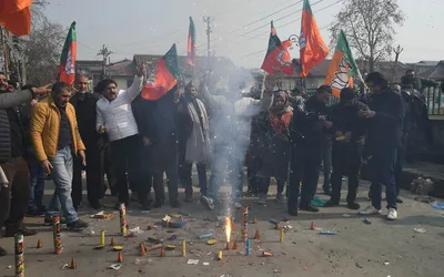 jubilant bjp workers in kashmir celebrate party s poll victory in 3 states