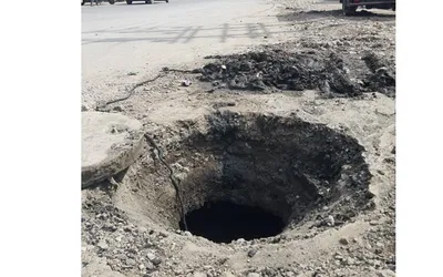 potholes  uncovered manholes on khayam nowpora road endanger commuters