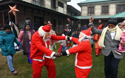 christmas celebrated with religious fervour   devotees throng holy family catholic church in srinagar