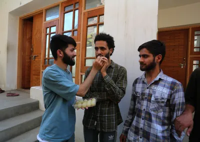 people throng engineer rashid’s residence to celebrate his win