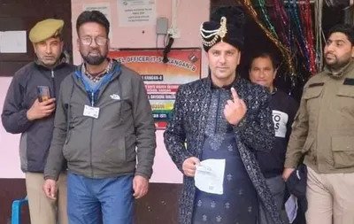 on wedding day  groom goes to polling station to cast his vote in kangan