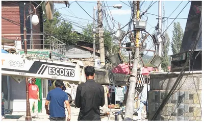 dangerously tilted electric pole removed in baramulla
