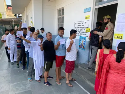 long queues outside polling booths in jammu reasi ls constituency