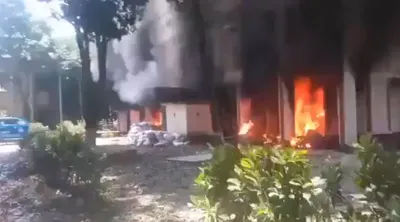 angry protesters set home minister s residence on fire in dhaka