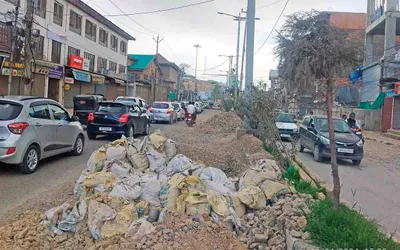 dilapidated roads  slow pace of works pester commuters in srinagar