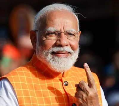 pm modi casts his vote during third phase of lok sabha elections in ahmedabad