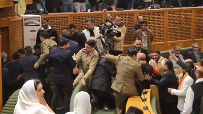 bjp mlas marshalled out amid ruckus in j k assembly