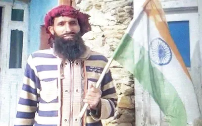 surrendered terrorist hoists national flag at his residence in kishtwar to celebrate republic day