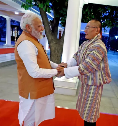 bhutan pm arrives in india