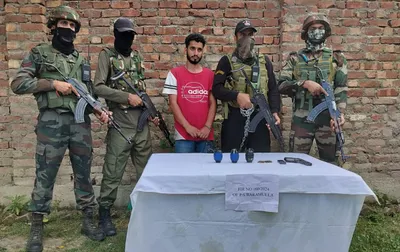 let associate held in baramulla  arms recovered  police