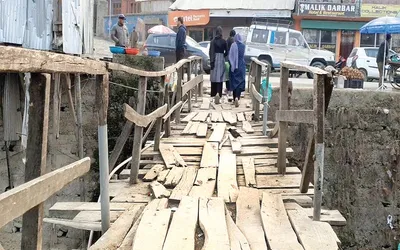 rickety wooden bridge in kupwara area poses threat to residents