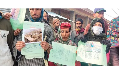 housing for all   bandipora villagers protest over deletion of names from prime minister s housing scheme