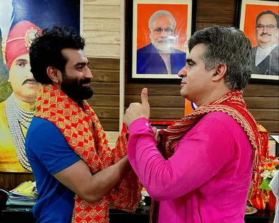 ravinder raina felicitates surya bhanu pratap